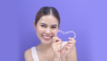 How do you handle discomfort or soreness during Invisalign treatment?